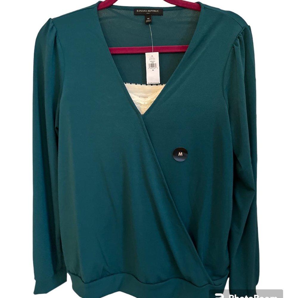 Banana Republic - size medium long sleeve green crepe wrap blouse.